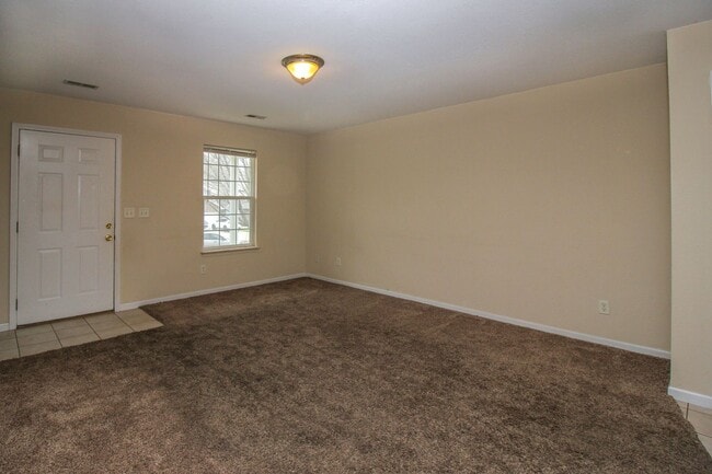 Photo - Spacious 4BR/2BA Duplex with 1 Car Garage & Washer/Dryer Included!