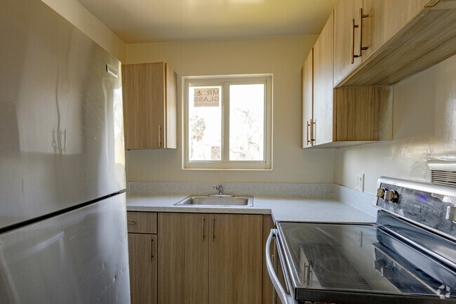 Kitchen with Window - Riverland Court Apartments