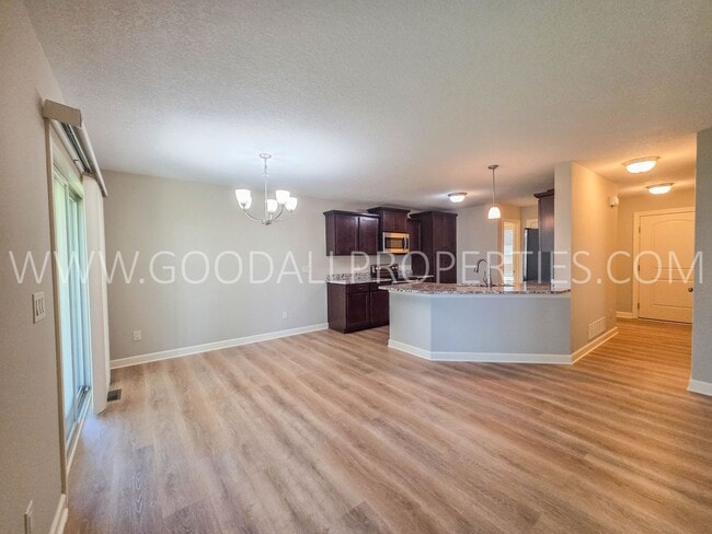 Photo - 4 Bed Waukee Home with Granite Counters & Covered Deck