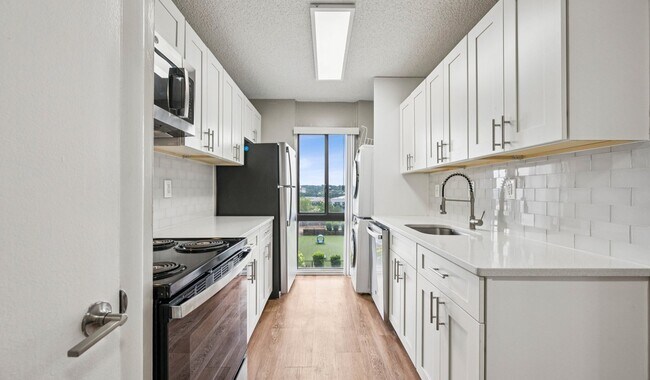 Your modern kitchen has large counter space and updated appliances - The Summit