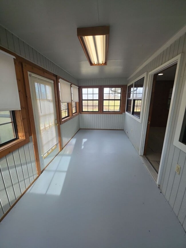 Photo - 2-Bedroom Handicap-Accessible Home with 3-Season Porch, Garage, and Large Yard