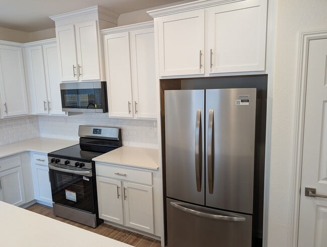 Photo - New Wilson home offering modern amenities, solar and a nice floor plan. Bonus room with den or of...