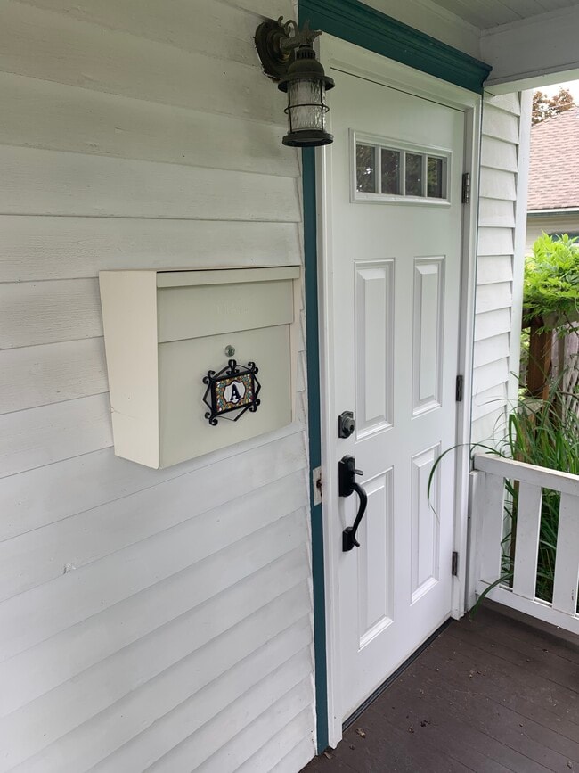 Entrance to upper Unit A with mailbox.