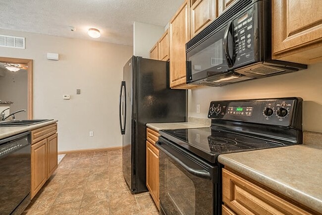 Sleek appliances and plenty of cabinet storage adorn our kitchens.