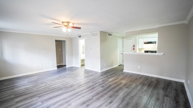 Spacious Living Room with Ceiling Fan - Windsor Manor Apartments