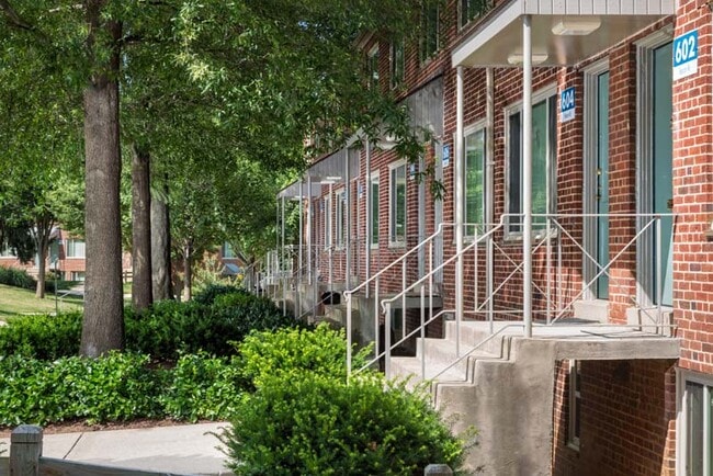 Two-level townhomes with private covered entry at Northwest Park Apartments in Silver Spring, MD
