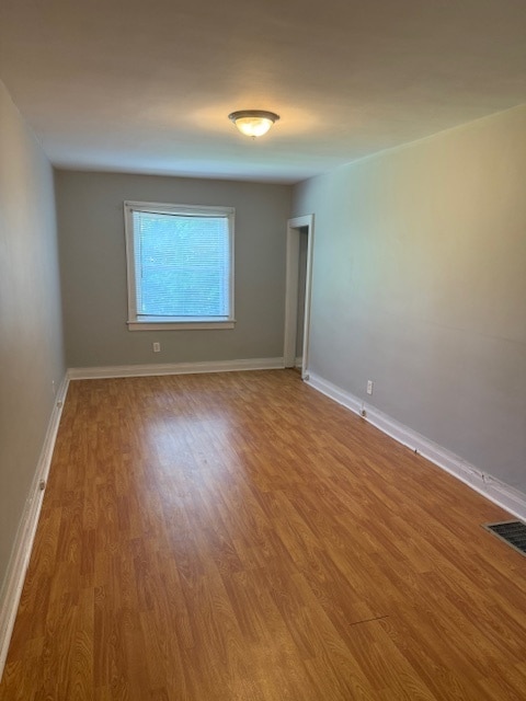 Photo - Adorable 2BR/1BA with spacious living area and wood floors throughout!