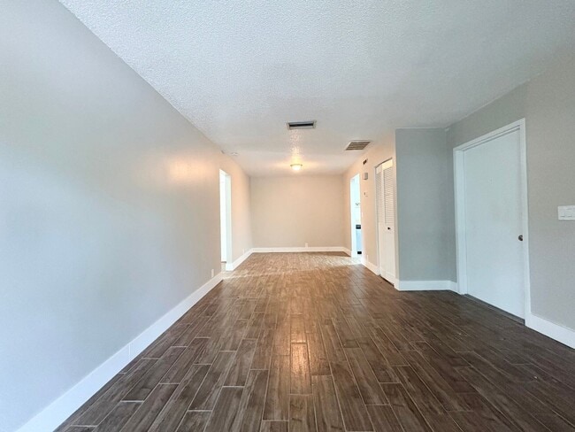 Photo - Nicely Updated 1/1 Condo in Winter Springs ~ Wood Plank Tile Floors and Large Screened Patio! Unit 4