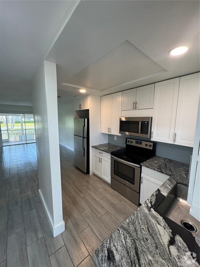 Building Photo - 9851 Sandalfoot Blvd Unit 208 Rental