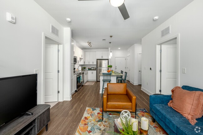 2BR, 2BA – 871SF - Living Room - Flats at College Park