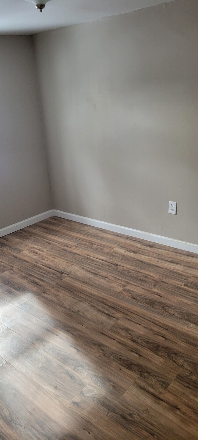 Photo - Two story house with full basement and garage.