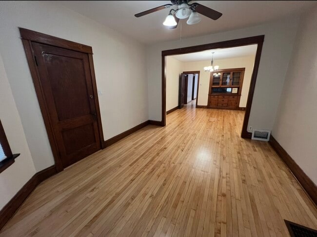 Living room with new ceiling fan - 3748 W Lyndale St Unit 1st