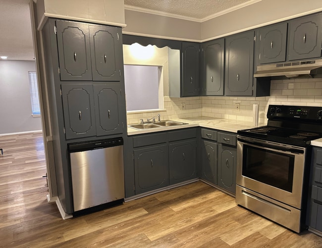 Kitchen w/Stainless Steel Appliances - 8302 Woodview Dr E Unit 8302 Woodview Drive East