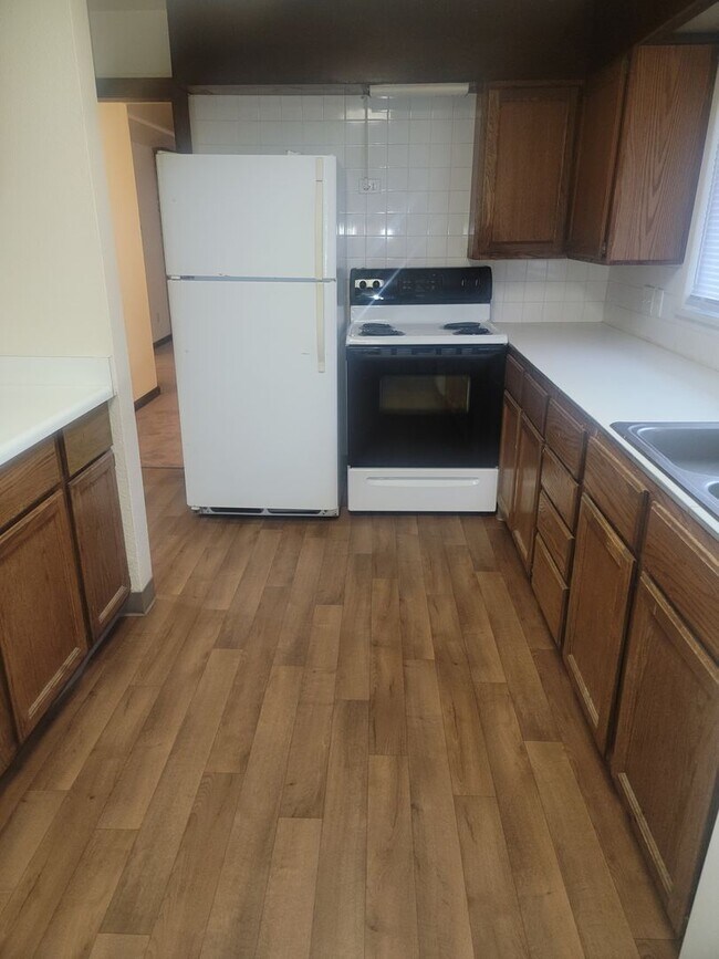 Photo - University Place 4 bedroom, 2 bath. Partially fenced yard