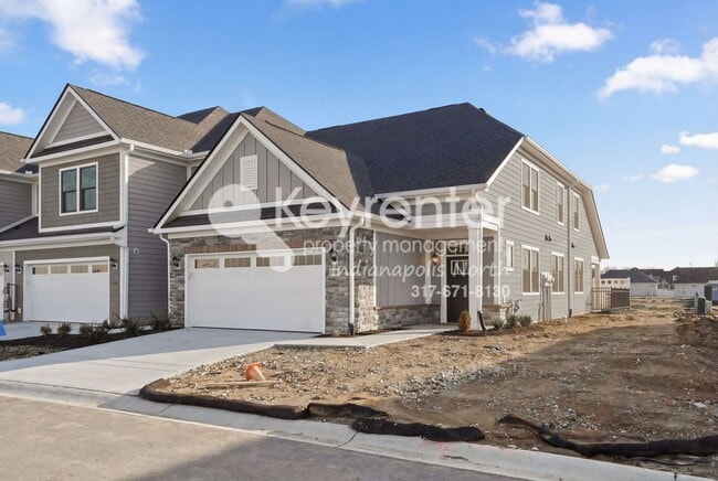 Building Photo - Located in Westfield, IN, this attractive 3-bedroom, 2.5-bath home sits on a corner lot within an...