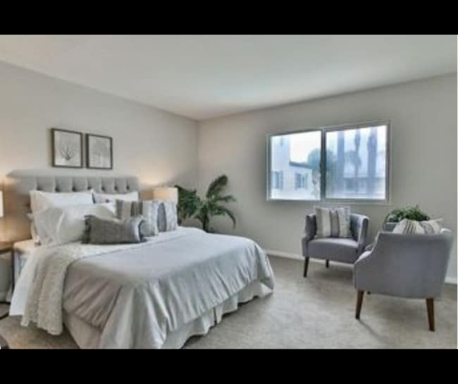 Furnished primary bedroom with closet space and natural light. - 940 Calla Ave Unit 8