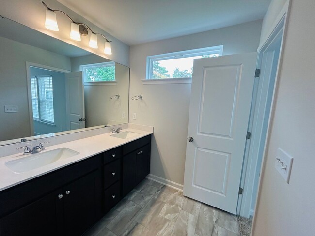 Photo - Stunning new end-unit 3 bedroom 2.5 bath townhouse in N High Point with attached garage.