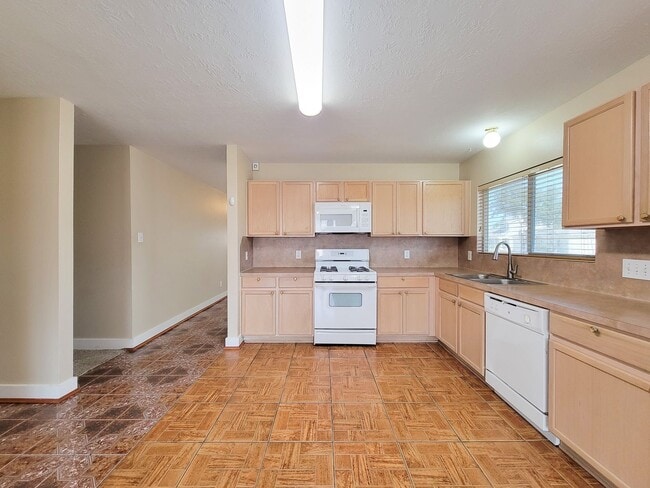 Photo - 3 bedroom one story home on large corner lot. Home has hard flooring throughout living areas and ...