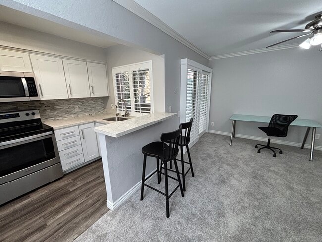 Kitchen, Breakfast, and Living - 7972 Mission Center Ct Unit C
