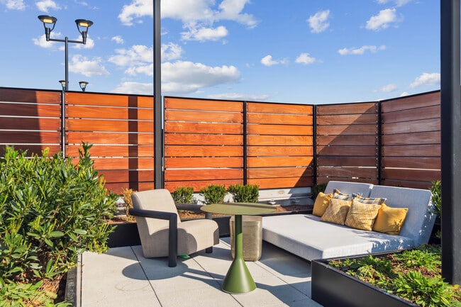 City views meet cozy vibes on the rooftop. - Residences at The Finery