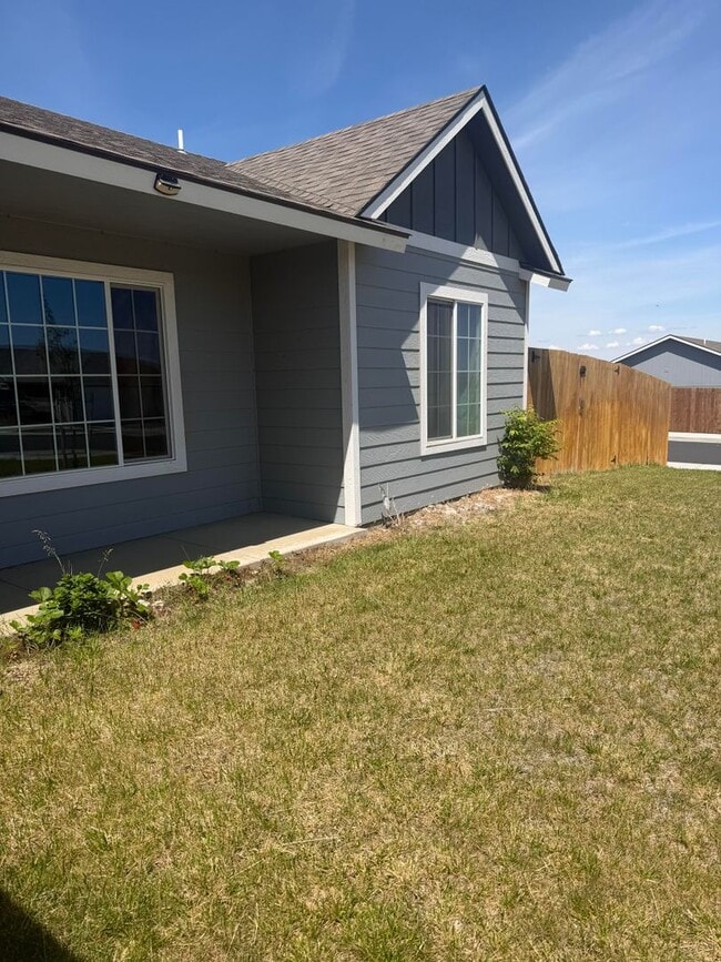 Photo - Lots of storage space in this 4- Car garage for all your playthings!!