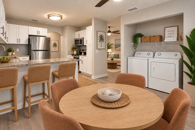 Transform your lifestyle at Indian Hills with this modern, open-concept kitchen and dining area. Enjoy the sleek appliances and stylish finishes that make every meal a delight. Schedule a tour today to see your future home!