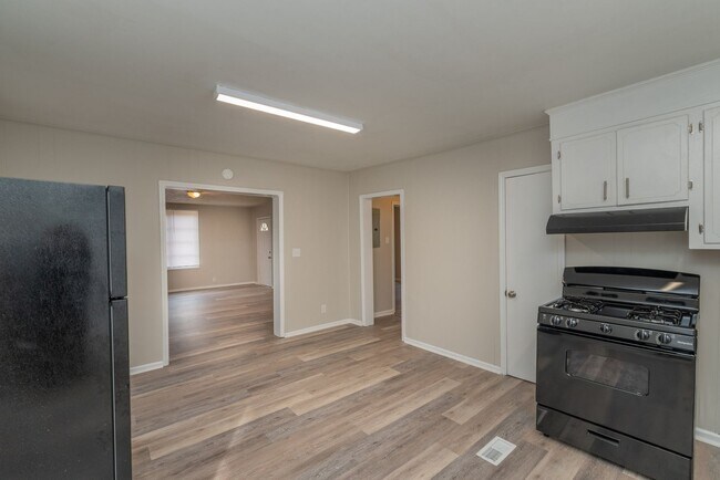 Photo - Brick home with a fenced-in yard! Section ...
