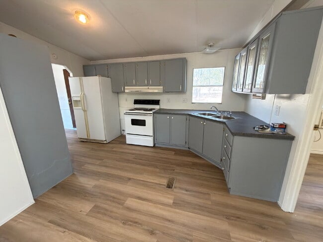 Photo - 3 bed 2 bath. New vinyl floors throughout. Unit A