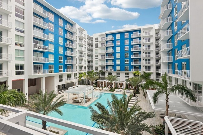 Heated zero-edge saltwater pool with sundeck, cabanas, fire pits and water feature - Blu Aventura