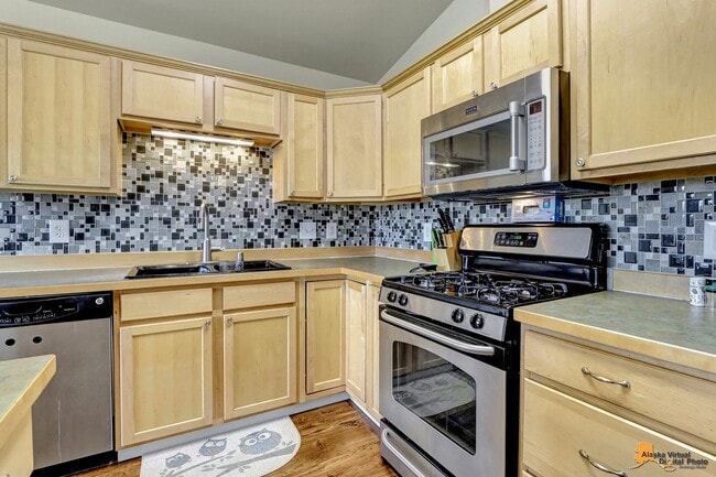 Building Photo - East Anchorage Home with Utilities Included!! Close to JBER! Attached Two Car Garage + Fenced in ...