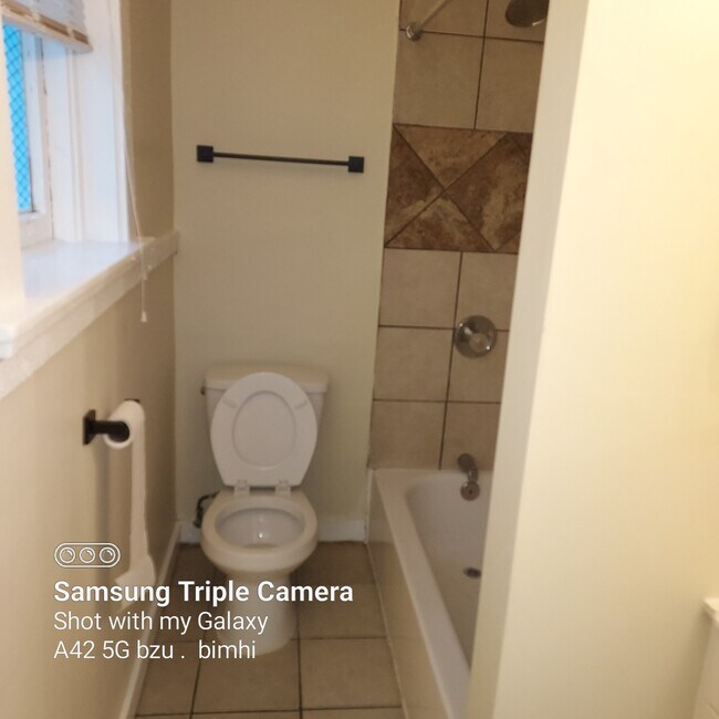 Tile shower and tub, tile floor - 107 Valencia St Unit 107 Valencia Apt 1