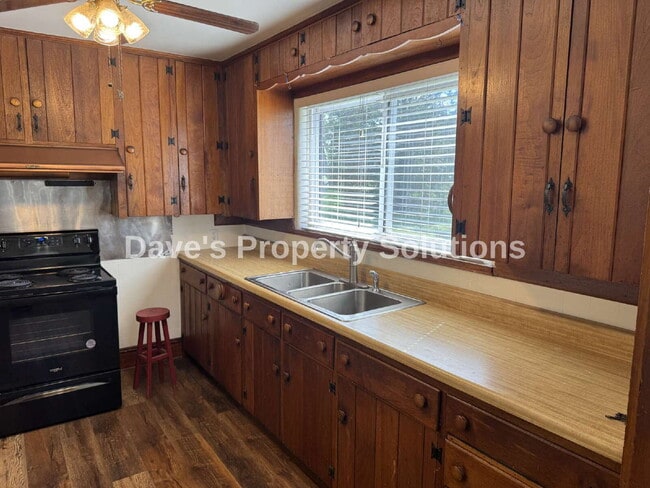Photo - Spacious Living on ~1 Acre! | 3-Car Garage + Extra Covered Parking | Landscaping Included!