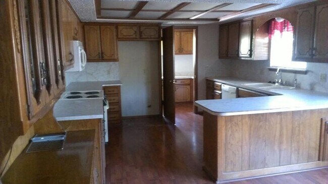 Photo - 3 car garage, corner lot, huge living with fireplace and covered patio in Moore School district