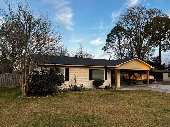 Photo - 2 Bedroom, 1 bathroom, Brick home , Stainless appliances, with Large Yard and Covered Parking.