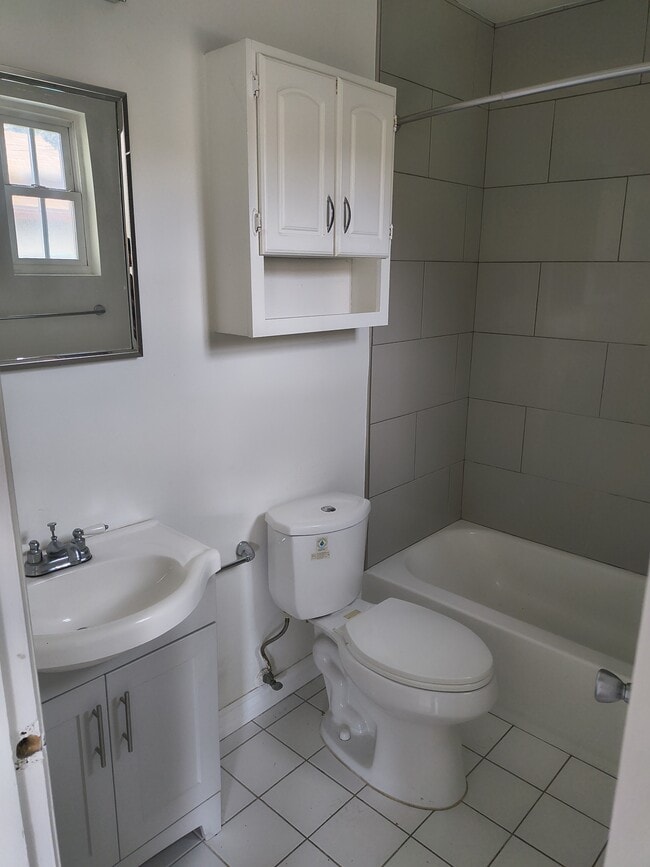 Bathroom and primary bedroom recently remodeled with new tile and Indian toilet and top - 2215 Carmona Ave