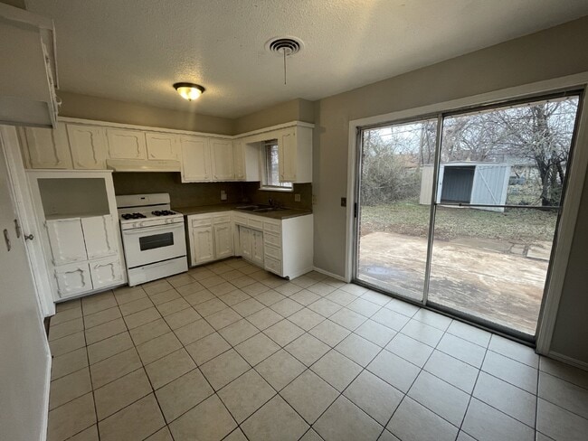 Photo - Charming 3-Bed, 1.5-Bath Home in Del City – Spacious Backyard & Garage!