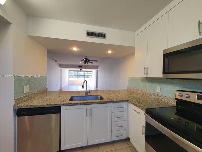 Building Photo - 3521 Village Blvd Unit 205