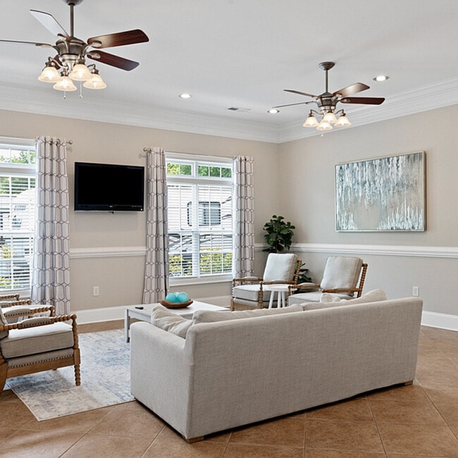 Experience comfort and style in this beautifully designed living room. - West Pointe