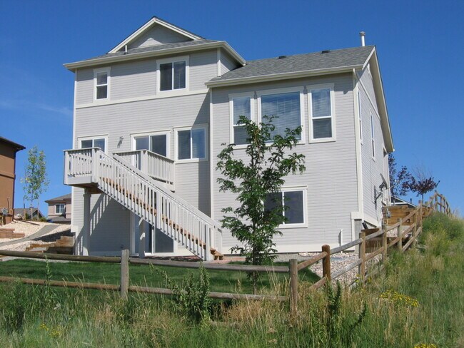 Rear view facing golf course; shown with old (smaller) deck - 9904 Antler Creek Dr