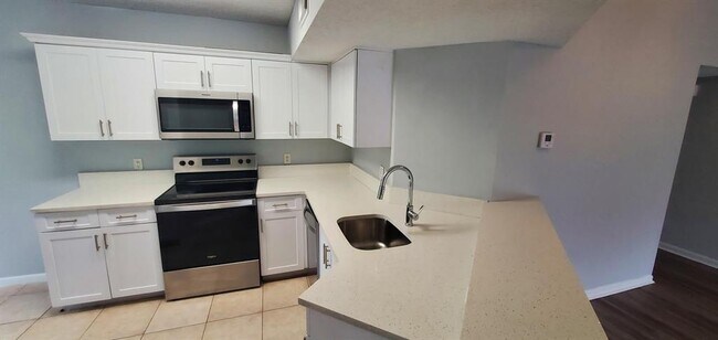 Photo - 9033 Wiles Rd Unit 9033 Wiles Rd