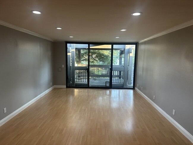 living room with oversized balcony - 7740 Redlands St Condo Unit G