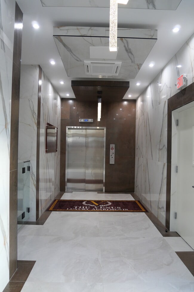 Hallway to Elevator - Venus Apartments