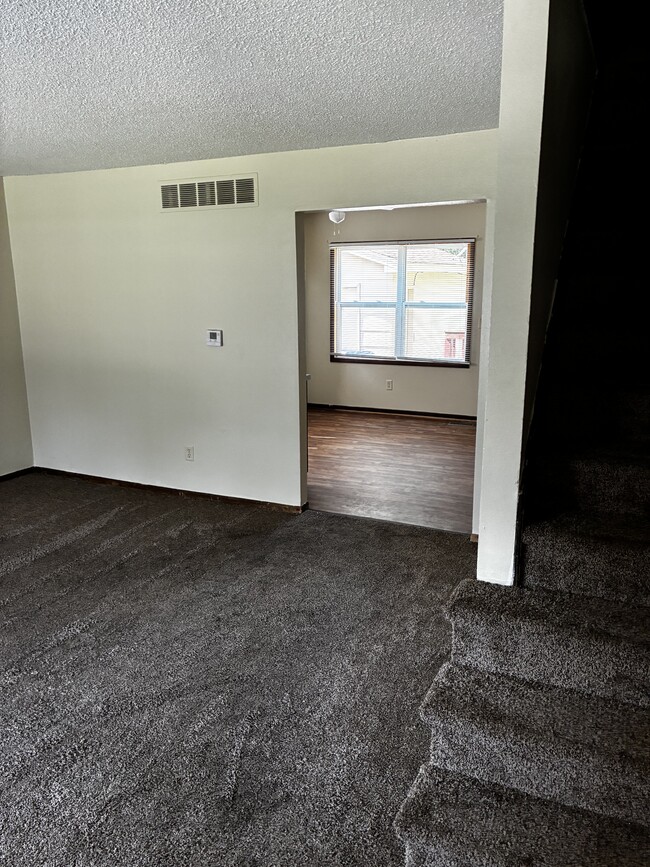 After you step inside, you see the living room and the entrance to the kitchen - 1205 Randolph St