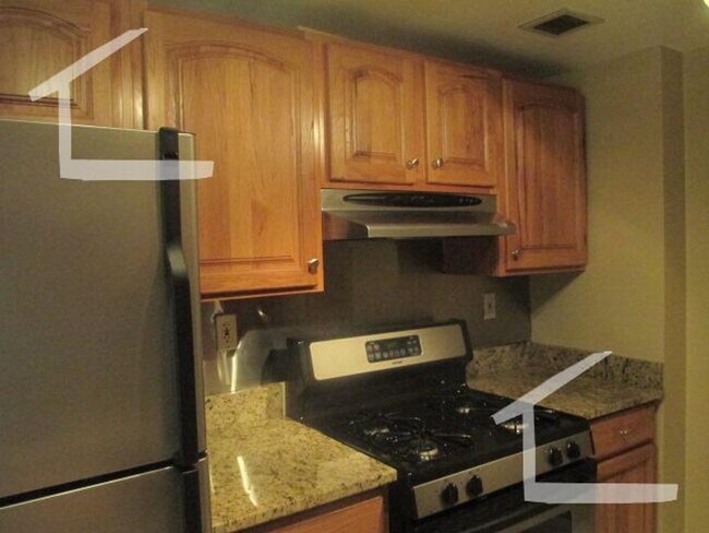Photo - Spacious Top-Floor 2-Bedroom with Heat Included & Garage Parking!