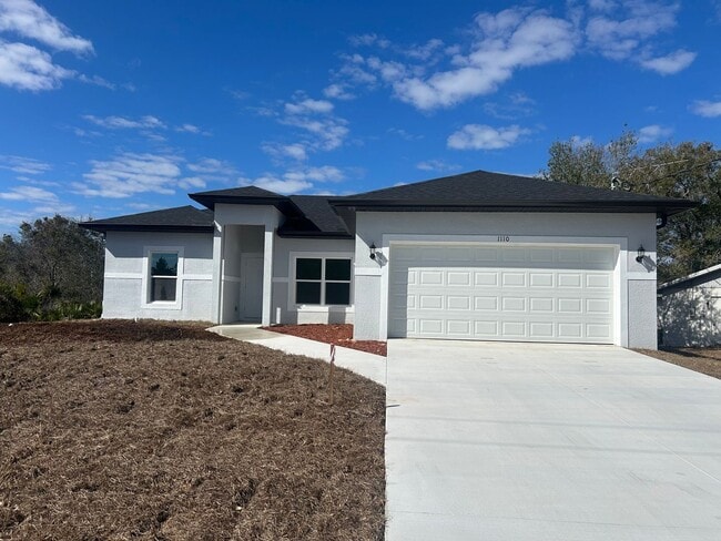 Building Photo - BRAND NEW Modern 4BR/2BA Home with Garage – Peaceful Lake Placid Retreat