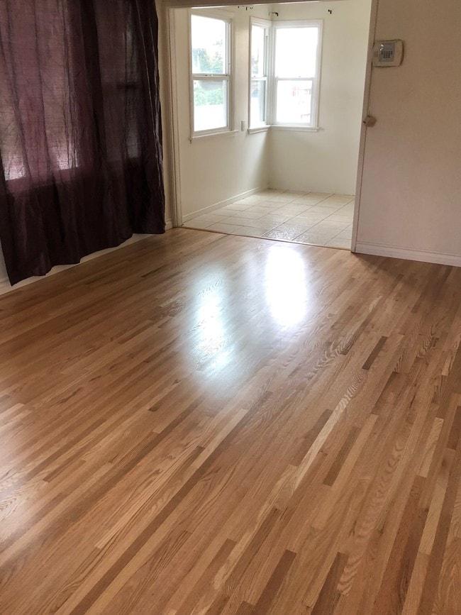 Brand new hardwood floors in living room - 601 N Park Ave