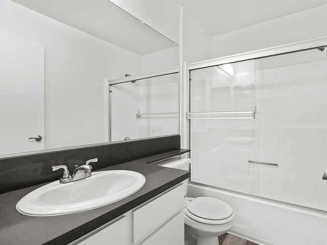 Modern styled bathroom with shower and tub.