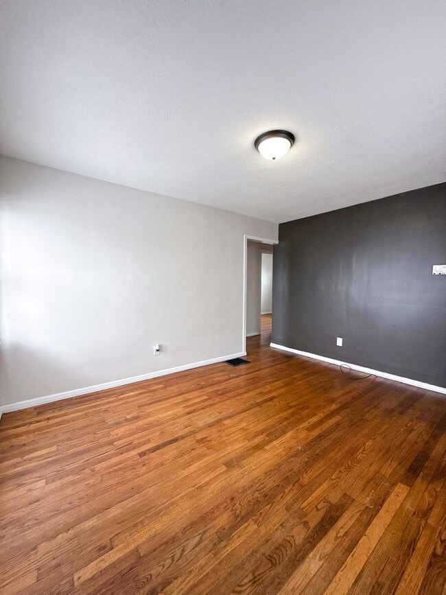 Photo - Move-In Ready 2BR Home w/ Refinished Hardwood Floors + Bonus Room Basement!