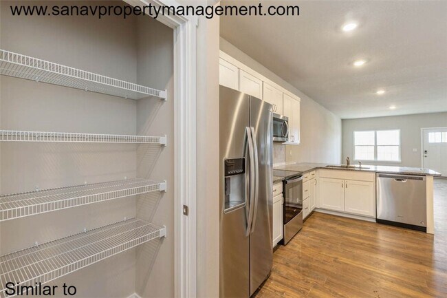 Photo - Modern Charm: 2-Bedroom, 2-Bathroom Home with Open Floor Plan and Rear Load Garage