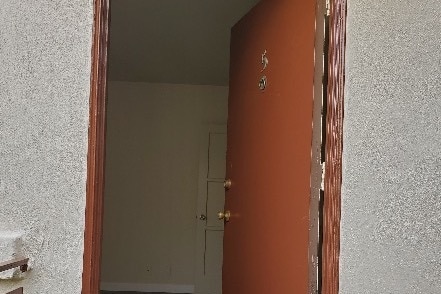 Frnt dr looking into living room - Westwood Apartments, Inc
